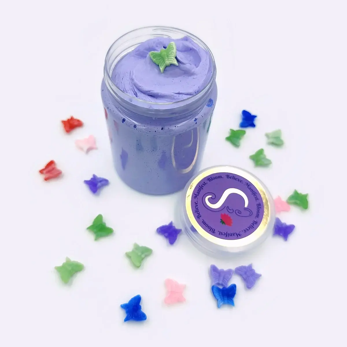 A Little Wish purple butter slime with a butterfly charm on top