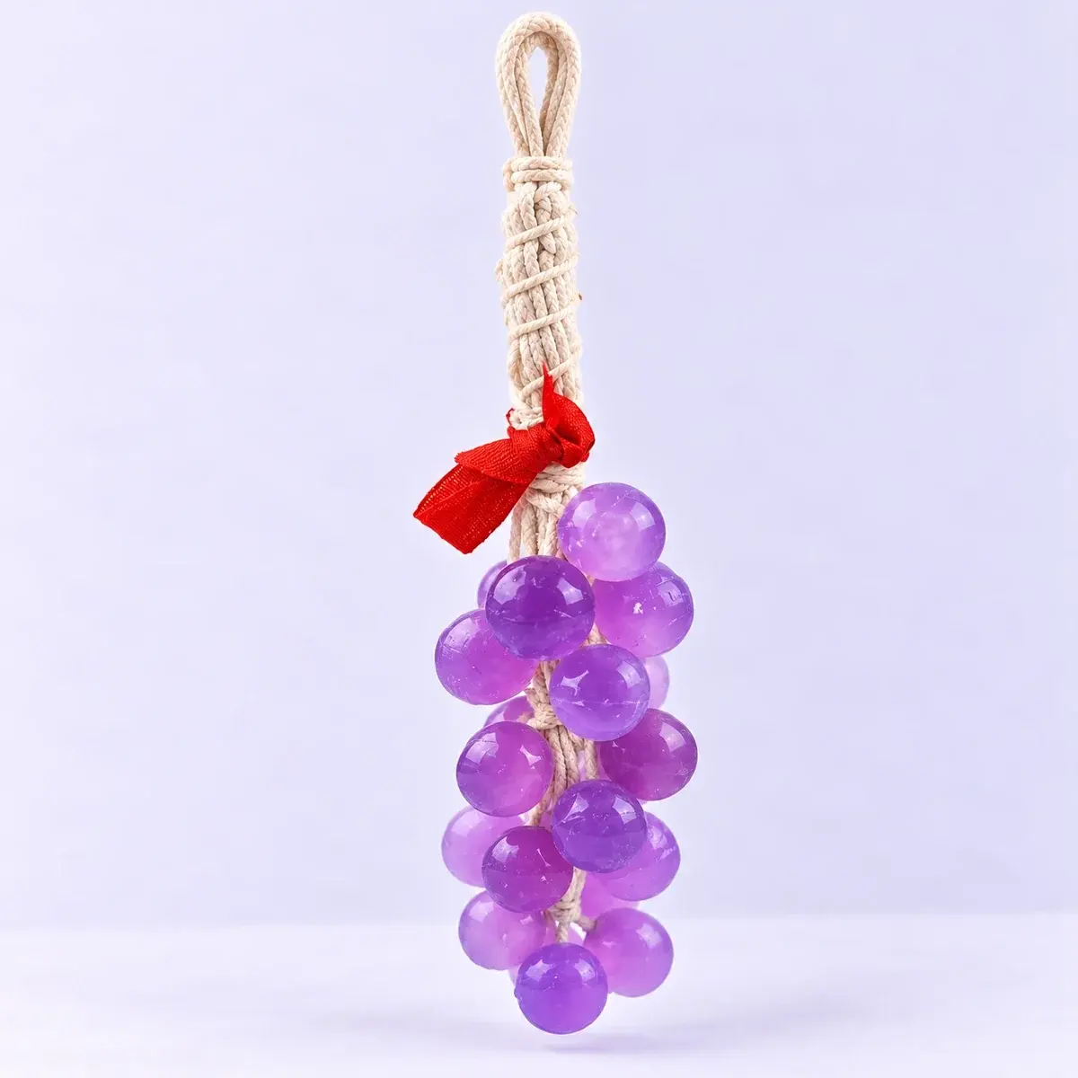Purple handmade grape soap on a braided cord